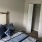 a bedroom with a bed and a door
